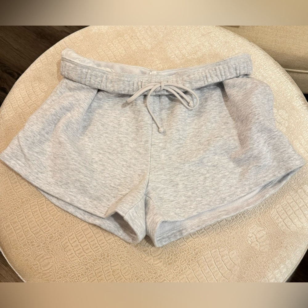 Skims classic short in light heather gray. Drawstring and pocket details.
